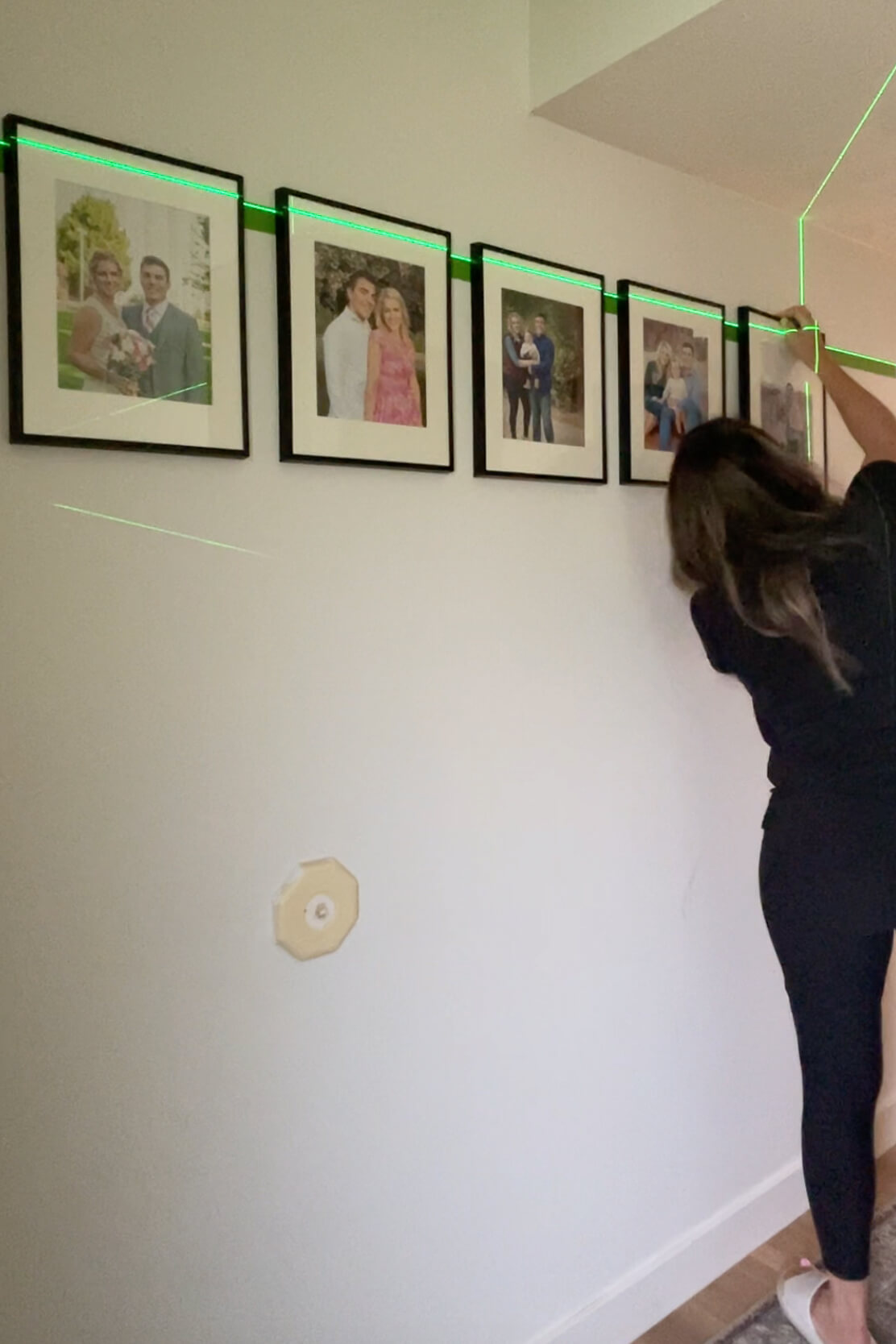 Hanging a gallery wall with family photos.